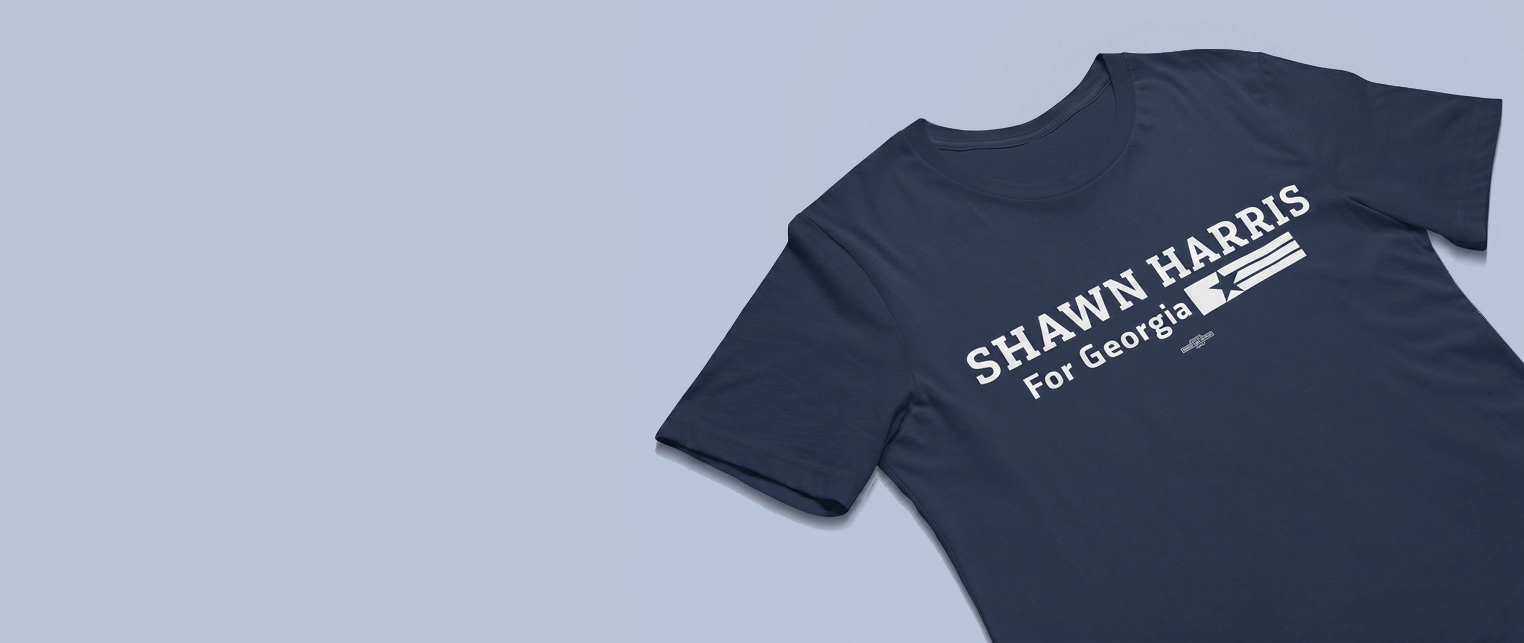 Navy blue t-shirt with 'Shawn Harris for Georgia' text on a light blue background