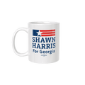 White ceramic mug with Georgia flag and "Shawn Harris For Georgia" text in blue and red.